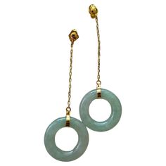 Avantgarde Donut Hoops Drop and Dangle Green Burmese A-Jade Jadeite Earrings (with 18K Yellow Gold) Our Avantgarde Hoops Drop and Dangle Green Burmese A-Jade Earrings are made from handpicking Burmese A-Jadeite, with superior translucency, hues and optics. We create stunning drop and dangle earrings with calibrated 18mm Hoops, paired with 18K Solid Yellow Gold chains and clasps. The Burmese A-Jadeite is completely untreated, unenhanced, and natural. Each piece is truly unique and one-of-a-kind, Gold Donuts, Donut Earrings, Earring Video, Donuts Earrings, Jade Earrings, Disc Earrings, Yellow Gold Chain, Jade Stone, Modern Earrings