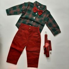 Dress up your little one in this adorable Moyikiss Studio 3-piece outfit set. The set includes a red and green plaid shirt, green suspenders, and matching green pants. Perfect for any occasion, this outfit is versatile and stylish. The shirt features a classic button-up design while the pants have an elastic waistband for a comfortable fit. It's ideal for babies and toddlers, aged 6-12 months, and is suitable for both boys and girls. Add this charming set to your child's wardrobe today! Fitted Green School Sets, Fitted Green Sets For School, Cotton School Sets For Fall, Green Suspenders, Green Plaid Shirt, Green Pants, Pant Shirt, Green Plaid, Outfit Set