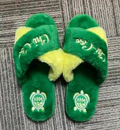 FUZZY CHI SLIPPERS!   These fuzzy house slippers are sure to  keep your toes warm and relaxed after a long day in the unit. Every nurse needs comfort and luxury.  These slippers offer comfort durability and would pair well with your chi eta phi pajamas!  Represent our organization and pair with your chi pajamas  at your  university's org pajama parties or in the comfort of your home. 🐢 💛💚 🐢 colors green and yellow 🐢 Shipped in TT&Co bag   🐢 Washing Instructions: -  not recommended.  🐢 3 s Comfortable Green Slide Slippers, Casual Indoor Slide Slippers, Green Non-slip Slippers For Leisure, Comfortable Green Flat Flip Flops, Green Comfortable Flat Flip Flops, Green Cushioned Slippers With Round Toe, Comfortable Soft Indoor Slippers, Comfy Round Toe Slippers For Home, Green Cushioned Flat Slippers