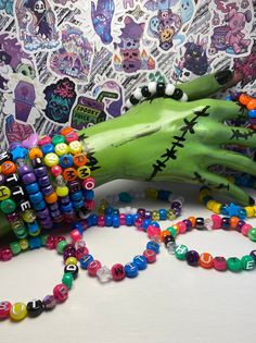 This listing is for a mystery bag of 5 randomly selected kandi bracelets !  Bracelets are made with elastic cord.  Bracelets themes are spooky/Halloween/comic con based.  This is the perfect mystery bag to add to your collection ! Personalized Rave Beaded Bracelets As Gift, Personalized Rave Beaded Bracelets For Gifts, Personalized Rave Beaded Bracelet For Gift, Rave Style Multicolor Friendship Bracelets With Letter Beads, Personalized Multicolor Beaded Bracelets For Rave, Multicolor Rave Friendship Bracelets As Gift, Colorful Beads Rave Style Beaded Bracelets For Gifts, Multicolor Rave Style Friendship Bracelets As Gift, Multicolor Themed Beaded Bracelets For Friendship