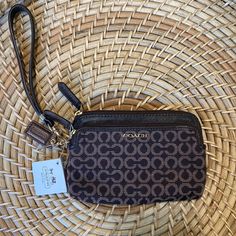 Nwt Coach Wristlet Brown Leather With Two Zippered Pockets Brown Pouch Wristlet For On-the-go, Brown Wallet With Wrist Strap For Everyday Use, Brown Everyday Wallet With Wrist Strap, Classic Brown Wristlet For Everyday Use, Brown Clutch Wristlet For Everyday Use, Brown Clutch Wristlet, Brown Everyday Clutch Wristlet, Chic Brown Wristlet For Everyday Use, Brown Coach Bag With Wrist Strap