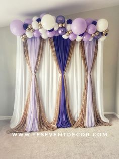 purple and white balloon backdrop with gold sequins on the top for a party