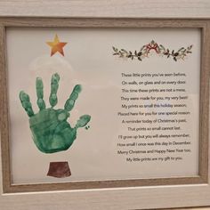 a handprinted poem with a star on the top is displayed in a wooden frame