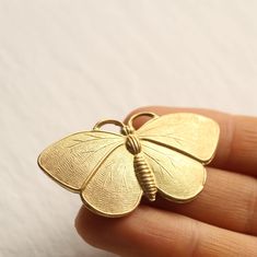 This moth or butterfly brooch is a solid brass metal stamping in a beautiful, deep gold colour.   The brooch measures 50mm (two inches) wide and 25mm (one inch) high. We have attached a gold plated brooch back with secure fastening. This piece of jewellery comes packaged in a nice recycled gift box with a handmade tag, all ready to give or keep. 🖤 FASTER SHIPPING 🖤 Need this fast? We offer a Faster Shipping option here: https://www.etsy.com/uk/listing/100107311/faster-shipping-priority-post-up Rosy Moth, Moth Brooch, Woodland Cottage, Silk Purse, Hand Painted Gifts, Winter Jewelry, Insect Jewelry, Handmade Tags, Photo Locket