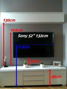 the tv is mounted on the wall with measurements