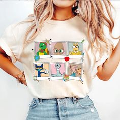 a woman wearing a t - shirt with pictures of cartoon characters on the front and back