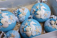 some blue and white ornaments in a box