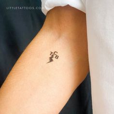 a person with a small tattoo on their arm