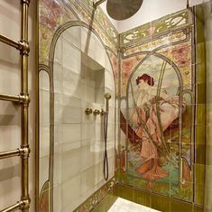 a bathroom with an art nouveau shower and tiled walls