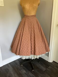 "1950's Vintage Quilted Circle Skirt in great condition. Unlined, metal zipper at back with two buttons.  Front waistband curves into a downwards point, very flattering. Small hole at inside waistband and broken thread ( see pictures for detail). Looks amazing over a crinoline. Size Vintage 13.  Very small waist. Measurements: Waist - 24\" Hip - Free Length from top of back waist band - 27\"" Vintage Circle Skirt, Vintage Flared Lined Skirt, Vintage Full Skirt With Lining, Fitted Vintage Skirt For Vintage Fashion, 1950s Fitted Skirt, Vintage Full Lined Skirt, Vintage Fashion Full Skirt, Vintage Fitted Lined Skirt, 1950s Style Full Skirt With Lining