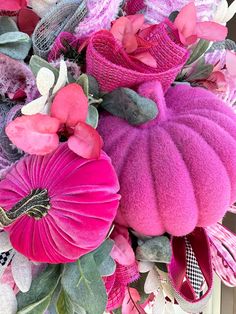 a pink and purple wreath with flowers on it