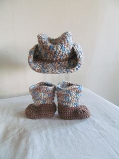 These boots and hat are hand made in blue camo and golden brown.  These are available in other sizes and colors as well.  Send me a message if you would like this in a different size or color.  Make sure to check out my other listings as there may be a listing in the color you want.  If not, send me a message and I can set it up for you.  When checking out, let me know if you would like embellishment added and what you are thinking.  You can also message me and I can send you ideas from others I have done.  Feel free to ask questions! Crochet Baby Cowboy Boots Free Pattern, Crochet Baby Boy Boots, Crochet Baby Photo Props Patterns Free Cowboy Hats, Crochet Baby Cowboy Boots, Crochet Baby Hunting Hat, Baby Cowboy Boots, Blue Camo, Baby Cowboy, Jan 11