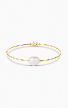 14k gold or rhodium plated freshwater pearl bangle bracelet with lobster clap closure. product note : freshwater pearls vary in texture, shape and size. These subtle differences make each pearl bracelet unique. Classic Gold Plated Pearl Bracelet, Classic Gold-plated Pearl Bracelet, Elegant 14k Gold-filled Pearl Bracelet Gift, Elegant 14k Gold-filled Pearl Bracelet, Adjustable 14k Gold-filled Pearl Bracelet, Pearl Bangle Bracelet, Pearl Bangle, Pearl Bracelet, Bangle Bracelet