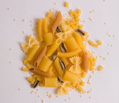 pasta shells with sunflower seeds on a white surface