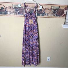 Abel The Label Sz S Lilac Dream Purple Smocked Floral Ruffled Maxi Dress Flowy Purple Tiered Dress With Floral Print, Multicolor Smock Maxi Dress For Spring, Purple Midi Dress With Smocked Bodice, Purple Midi Length Sundress For Vacation, Casual Purple Floral Print Sundress, Casual Multicolor Midi Dress With Smocked Back, Purple Casual Maxi Dress, Casual Purple Maxi Dress For Day Out, Purple Tiered Beach Dress