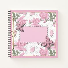 a notebook with pink flowers and butterflies on it