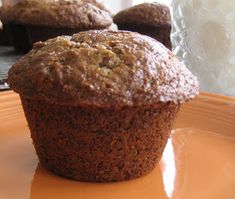 several muffins sitting on top of a white cloth