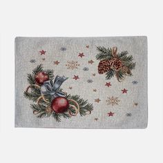 a white rug with christmas decorations and pine cones on the front, along with stars and snowflakes