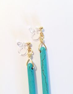 "Before you buy, be sure to get 20% off your order by joining the Balm Designs VIP Club! Just copy and paste this url in a new tab and you will get your instant coupon code: http://bit.ly/BalmDesigns These earrings feature beautiful turquoise spikes that dangle gorgeously on high quality resin (invisible) clip on earrings. I love the way these earrings dangle with every move! These clip on earrings looks just like regular earrings because the resin clip is clear in color which makes it transpare Design Vip, Turquoise Gemstone Earrings, Turquoise Earrings Dangle, Etsy Earrings Dangle, Fun Earrings, Turquoise Gemstone, Gemstone Earrings, Ear Piercings, Clip On Earrings