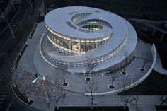 an aerial view of a circular building at night