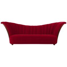 a red couch sitting on top of a white floor