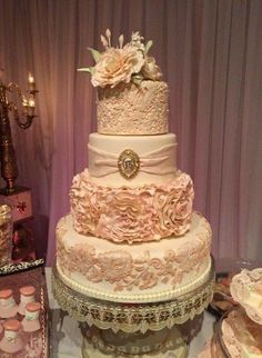 a wedding cake is displayed on a table