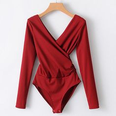 This long sleeve bodysuit featuring a plunging v-neck is the perfect item to bring you look together. Pair with jeans, leggings, skirt or shorts ... so be sure an visit our bottoms collection to find the perfect partner. Made with a polyester & cotton blend and comes in 6 fab colors. Long Sleeve Bodysuit Women, Black Backless Jumpsuits, Solid Jumpsuit, Backless Bodysuit, Backless Jumpsuit, V Neck Bodysuit, Chic Top, White Bodysuit, Long Sleeve Jumpsuit