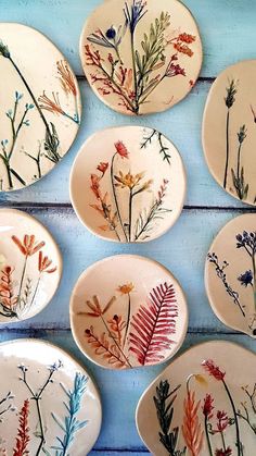 several plates with flowers painted on them