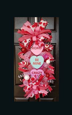 a valentine's day wreath on the front door