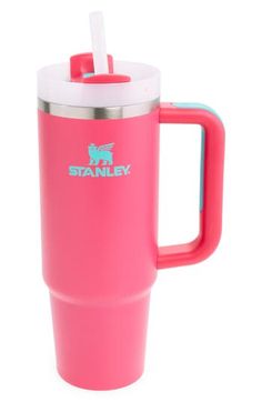 a pink travel mug with a straw in it