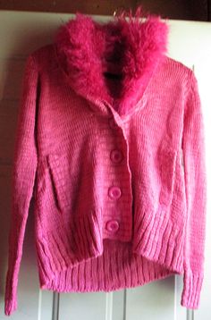 Fitted Pink Cardigan For Winter, Pink Knit Cardigan For Winter, Pink Knitted Sweater For Cold Weather, Pink Knit Outerwear For Cold Weather, Pink Knit Cardigan For Cold Weather, Pink Soft Knit Outerwear For Cold Weather, Pink Winter Sweater For Cold Weather, Warm Pink Sweater For Winter, Winter Knit Pink Cardigan