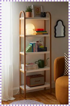 a book shelf in the corner of a room with a chair and lamp on it