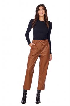 The Ballard Leather Pants are a stylish and versatile addition to any wardrobe. Crafted from high-quality faux leather, these wide leg pants offer a sleek and edgy look. The elastic waist ensures a comfortable and secure fit, while the faux pockets add a touch of sophistication. With an inseam measuring approximately 26 3/4" on size small, these pants are designed to flatter and elongate the legs. Made from PU leather, they provide the luxurious feel and appearance of genuine leather without the Leather Pants Brown, Fall Brown Wide-leg Leather Pants, Fall Faux Leather Wide-leg Pants, Wide-leg Leather Pants For Work In Fall, Trendy Wide-leg Leather Pants, Trendy Brown Wide Leg Pants For Fall, Fall Workwear Solid Leather Pants, Casual Leather Pants With Elastic Waistband For Fall, Trendy Leather Bottoms For Business Casual