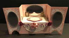 an elaborately decorated table with speakers on it's sides and a cake in the center