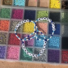 the beads are arranged in different colors and sizes to make a beaded name necklace