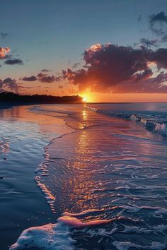 the sun is setting over the ocean with foamy water on the shore and clouds in the sky