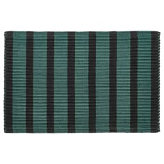 a green and black striped rug on a white background