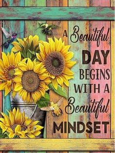 a beautiful day begins with a beautiful minds quote and sunflowers in a bucket