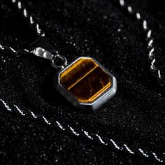 The Tigers Eye Pendant. Created using cuts of a Tigers Eye Gem. Every stone is unique making it the perfect necklace for your unique style.  Also available in 18K Gold. DETAILS Pendant size: 1.5cm x 1.5cm  Chain styles: Rope (2.5mm) - Can be added to any chain. Materials: Stainless Steel / 18K Gold PVD Plating Necklace clasp: Lobster Packed in a Twistedpendant Jewellery Pouch Hypoallergenic Tigers Eye Gemstone SIZING This chain is available in lengths: 18", 45.7cm 20", 50.8cm  22", 55.8cm  - sta Mens Jewelry Silver, Chain Size Chart, Men Necklaces, Tigers Eye Gem, Etsy Jewellery, Necklace Clasp, Jewellery Pouch, Tigers Eye Necklace, Necklace Clasps