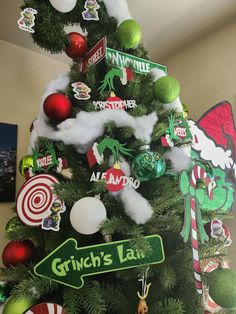 a christmas tree decorated with grin's land and candy canes is shown in this image