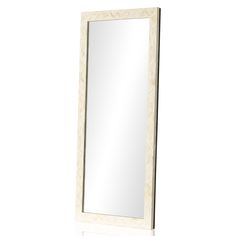 a white mirror sitting on top of a table