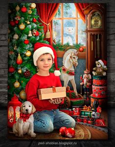 a young boy sitting in front of a christmas tree holding a box with presents on it