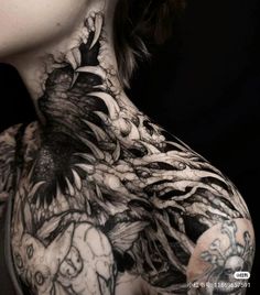 a woman with tattoos on her neck and chest