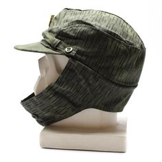 "Genuine Czech/Slovakian army camouflage cap M60 with metal insignia badge Czechoslovakian army issued model 1960's/1970's field cap. Similar to the east German NVA rain drop pattern camouflage Hat features button over the top ear flaps and adjustable chin strap Condition Like new, unused Shipping to United states, Canada, Europe * Economy shipping Shipping time : 7-21 working days or sometime more * Standard shipping with tracking information Shipping time : 7-14 working days or sometime more S Military Style Hat For Streetwear, Military Style Flat Cap For Outdoor, Military Style Outdoor Baseball Cap, Khaki Military Hats For Streetwear, Military Cap For Hunting, Military Style Flat Cap In Khaki, Military Style Baseball Cap For Outdoor, Green Military Flat Cap, Military Style Green Flat Cap