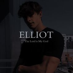 a man standing in front of a window with the words eliot on his chest