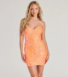 The Lilian mini dress is accented with a luxe sequin embroidered scroll pattern on lined mesh fabric for gorgeous glamour. The short dress features a V-neckline, a lace-up back that turns heads, and a figure-hugging bodycon silhouette. Perfect for a school dance or birthday!Fit & FeaturesSequin scroll patterned mesh fabric lined with stretchy knitStrapless V-necklineFlexible boning at the bodiceLace-up back, lower zipper with hook-eye closureMini-length bodycon silhouetteRuns true to size Strapless Sequin Dress For Spring Homecoming, Fitted Strapless Sequin Dress For Spring, Fitted Contrast Sequin Mini Dress For Spring, Fitted Mini Dress With Contrast Sequin For Spring, Holiday Strapless Mini Dress With Contrast Sequin, Orange Cocktail Dress, Orange Homecoming Dresses, Orange Cocktail Dresses, Birthday Fit