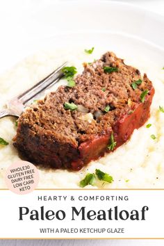 a white plate topped with meatloaf and mashed potatoes