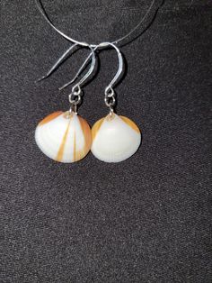 Hand made, hand picked from brevard county beaches Unique Nickel-free Earrings For Beach, Handmade Coastal Jewelry For Gifts, Handmade Coastal Style Jewelry Gift, Handmade Round Earrings For Beach, Unique Round Earrings For Beach, Nickel-free Round Earrings For Beach, Orange Dangle Jewelry For Beach, Nickel-free Orange Jewelry For Beach, Orange Drop Earrings For Beach