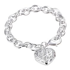 Every girl needs a charm bracelet. This bright silver charm bracelet has a fascinating hollow, puffed heart charm with intricate scroll design. Clip on more of your favorite charms for a one of a kind look. Fits up to an 8 inch wrist and is adjustable along the chain. Heavy lobster claw clasp for secure closure. Complete the look with a matching Puffed Heart Charm Necklace For Women Occasion: Birthday, Holidays, Valentine's Day, Mother's Day Materials: 925 Sterling Silver over Alloy Size: Heart Silver Heart Charm Bracelet For Gift, Silver Heart Pendant Bracelet With Charms, Silver Heart Pendant Charm Bracelet Gift, Silver Charm Bracelet With Heart Pendant As Gift, Silver Heart Bracelet With Charms, Sterling Silver Heart Shaped Bracelet With Charms, Elegant Silver Heart Charm, Silver Heart Pendant Charm Bracelet, Silver Charm Bracelet With Heart Pendant