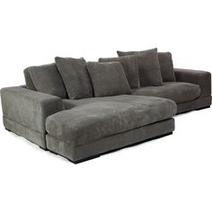 a gray sectional sofa with pillows on it's back and arms, facing the camera